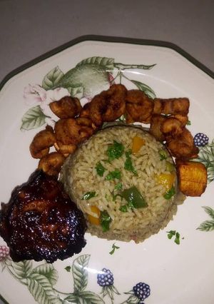 A picture of Native rice with plantain and turkey.