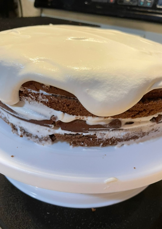 A picture of Chocolate whipped cream cake.