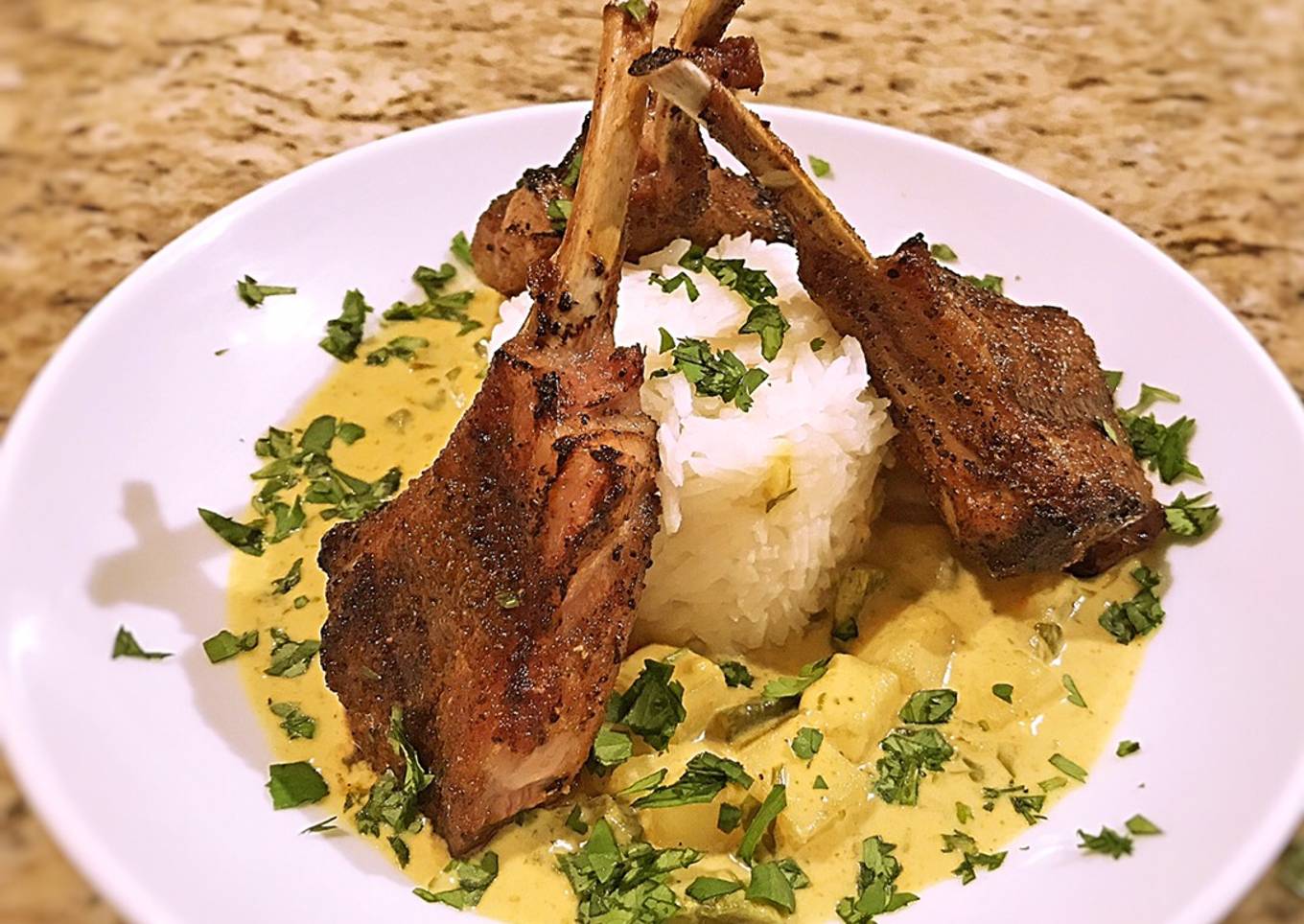Potato in yellow curry sauce with grilled lamp chops