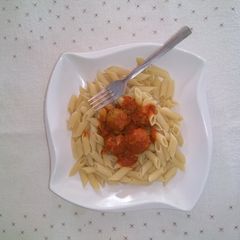 A picture of Pasta and meat ball sauce.