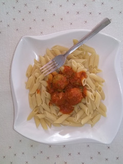 A picture of Pasta and meat ball sauce.