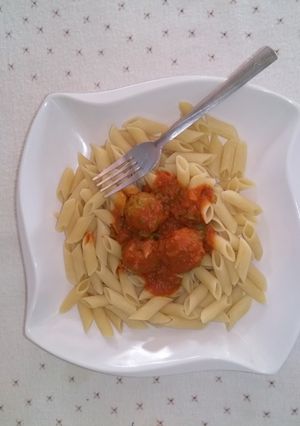 A picture of Pasta and meat ball sauce.