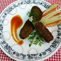 A picture of Chicken seekh kebabs.