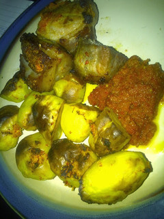 A picture of Roast pork & irish potatoes in pepper sauce.