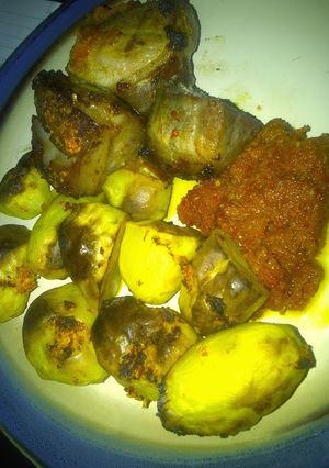 A picture of Roast pork & irish potatoes in pepper sauce.