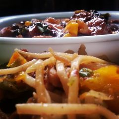 A picture of Thai stir fry chicken satay noodles with a fiery mushroom, sweet corn and cashew sauce.
