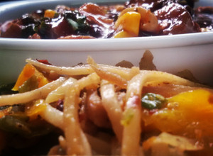 A picture of Thai stir fry chicken satay noodles with a fiery mushroom, sweet corn and cashew sauce.
