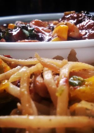 A picture of Thai stir fry chicken satay noodles with a fiery mushroom, sweet corn and cashew sauce.