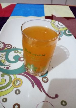 A picture of Fresh orange juice with pineapple.
