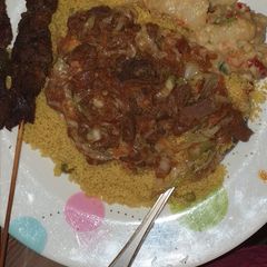A picture of Curried cous cous and veg sauce.