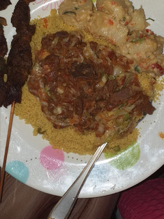 A picture of Curried cous cous and veg sauce.