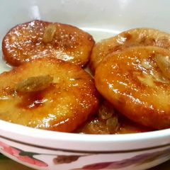 A picture of Rabri Malpua/Sweet Pancakes with condensed milk.