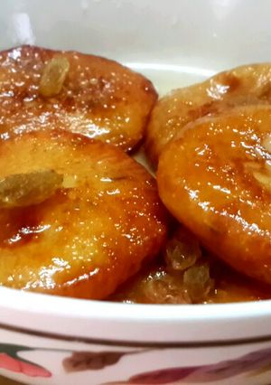 A picture of Rabri Malpua/Sweet Pancakes with condensed milk.