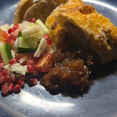A picture of Wild boar sausage rolls with truffle oil and christmas slaw.
