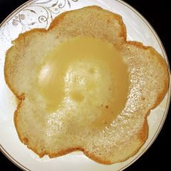 A picture of Appam with coconut milk.