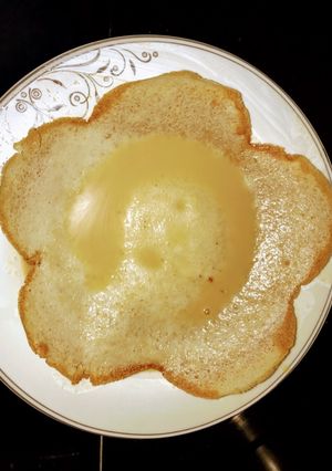 A picture of Appam with coconut milk.