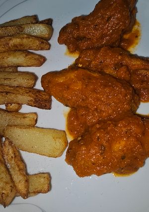 Una foto de Alitas de pollo en salsa de tomate