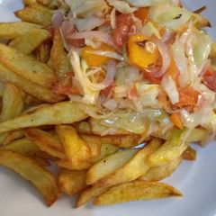 A picture of Chips and vegetable sauce.