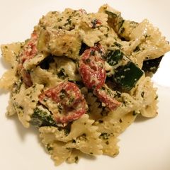 A picture of Zucchini, roasted pepper, goat cheese and pesto pasta salad.