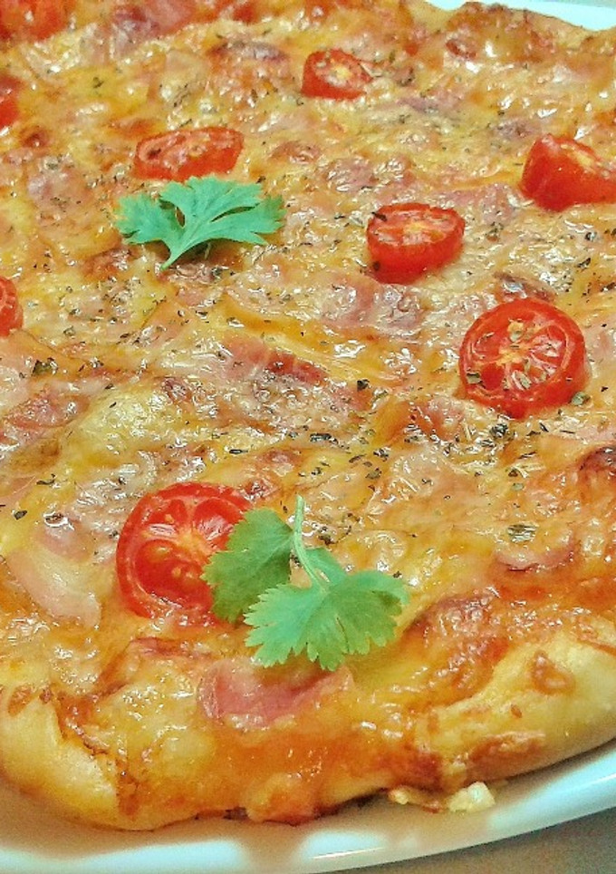Una foto de Pizza bacon y queso