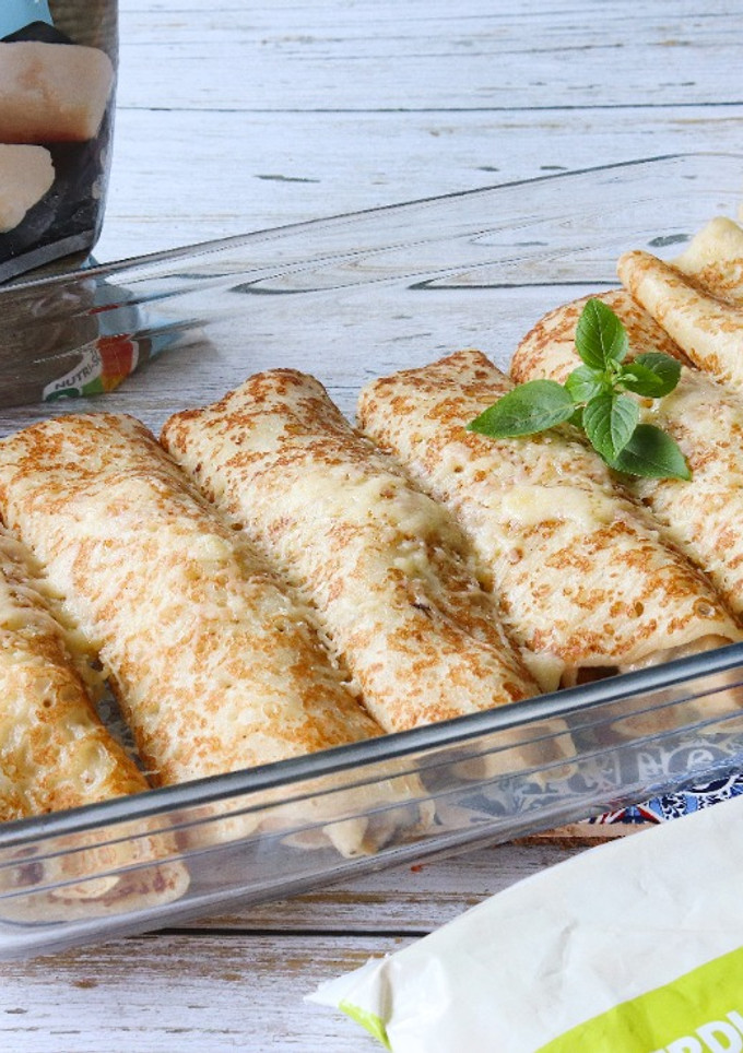 Una foto de Crepes rellenos de verduras asadas y merluza