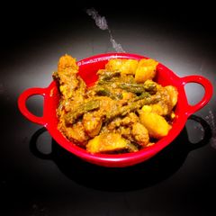 A picture of Chicken curry with vegetables.