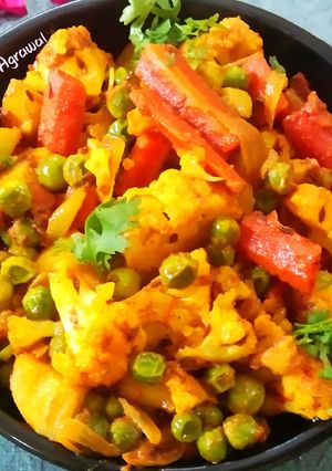 A picture of Cauliflower, Potato, Peas, and Carrot Curry.