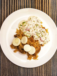 A picture of Green Chili Flavored Chicken Biryani with Kachumber Raita ☘️.