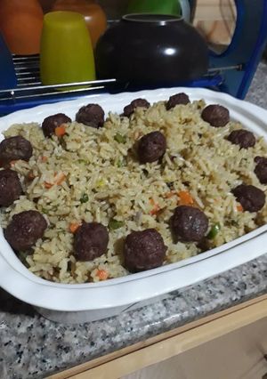 A picture of Fried rice with meat balls.