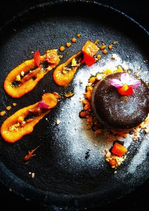 A picture of Deconstructed gajar halva representing carrot lava cake with carrot caramel sauce:.