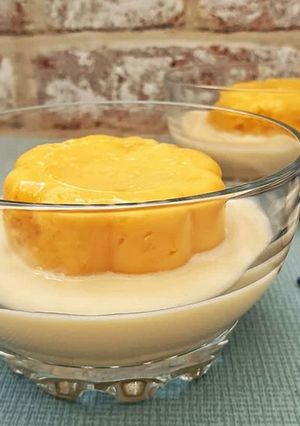 A picture of Corn Pudding with Custard Sauce.