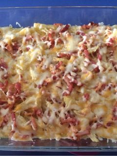 Una foto de Patatas Foster’s con queso y bacon