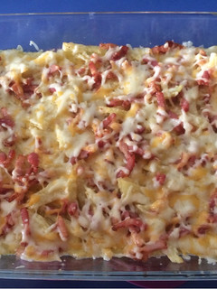 Una foto de Patatas Foster’s con queso y bacon