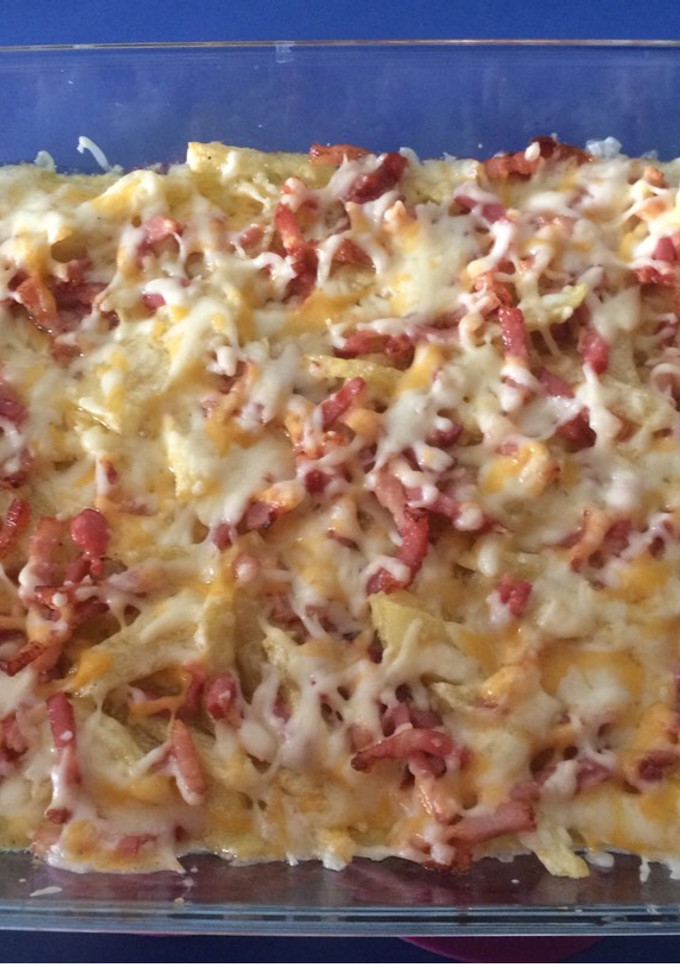 Una foto de Patatas Foster’s con queso y bacon