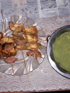 A picture of Paneer Tikka With green dip.
