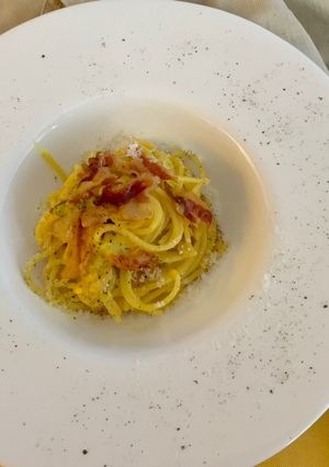 A picture of Spaghetti alla Carbonara with Rendered Guanciale.