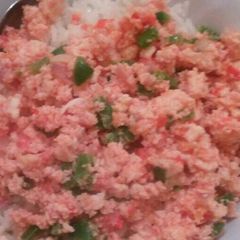 A picture of Scrambled eggs with white Rice.
