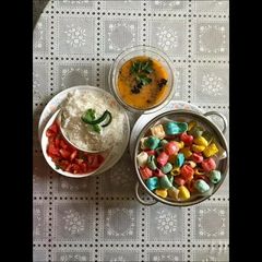 A picture of Toor dal chawal serve with papad.