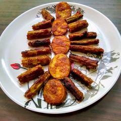 A picture of Drumsticks and Potato Masala Fry.
