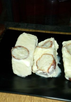 A picture of Vanilla icecream with gulabjamun.