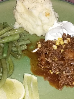 Una foto de Cordero rallado con judías verdes y puré de patatas