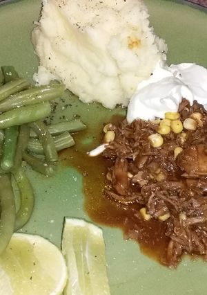 Una foto de Cordero rallado con judías verdes y puré de patatas