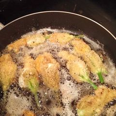 A picture of Fried stuffed Squash Blossoms.