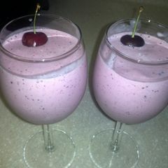 A picture of strawberry, banana ,blue Berry and mengo smoothie.