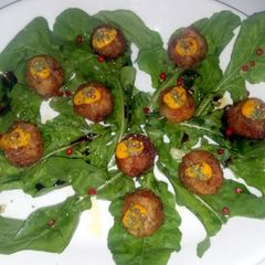 A picture of Zucchinni flower and goat cheese balls.