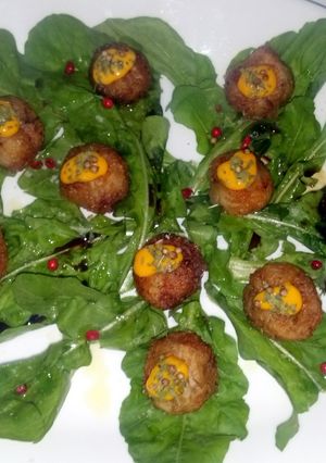 A picture of Zucchinni flower and goat cheese balls.