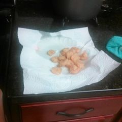 A picture of Golden brown fried shrimp.