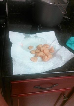 A picture of Golden brown fried shrimp.