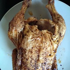 A picture of Indian Style Roast Chicken in a beer can.