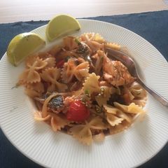 A picture of Salmon pasta with tomato sauce 🎏.